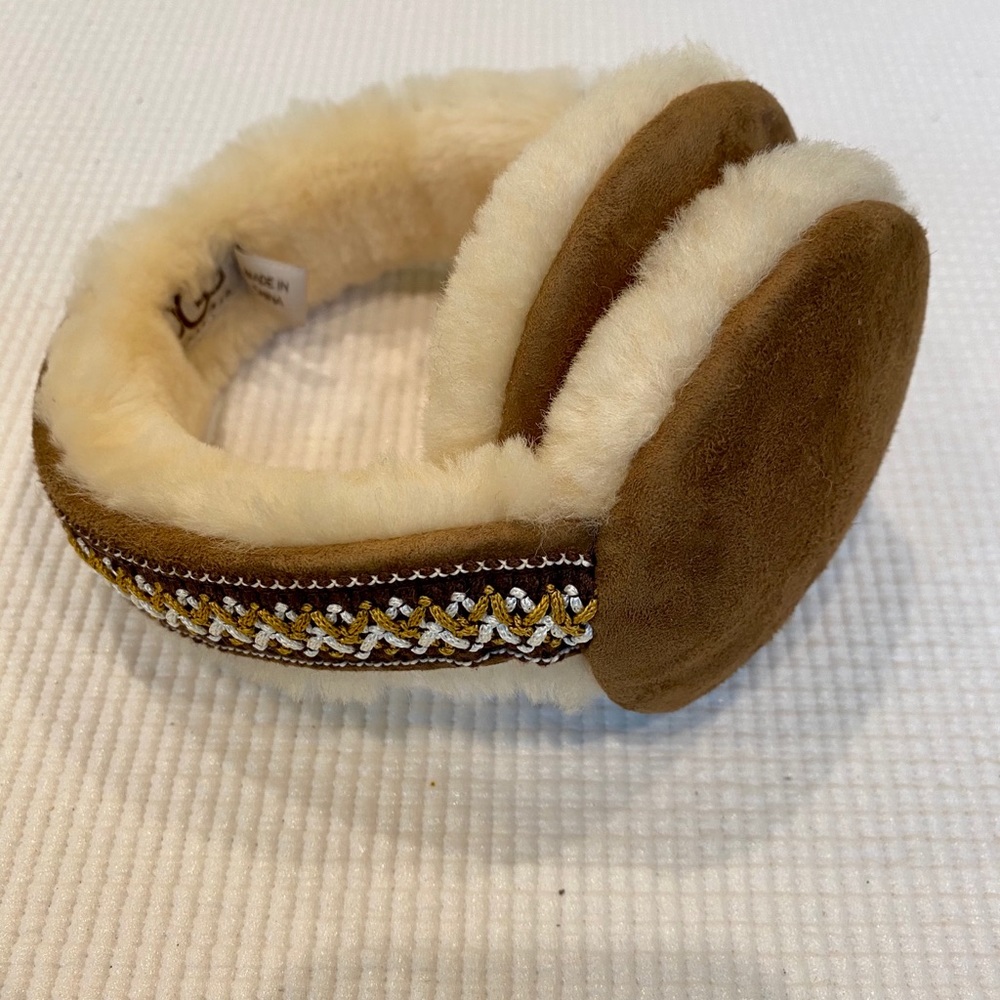 UGG ear muffs with embroidery detail. NWOT